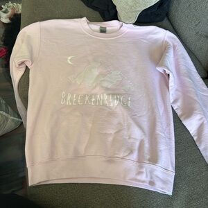 Pink pull over with Breckinridge Colorado logo. Size medium.